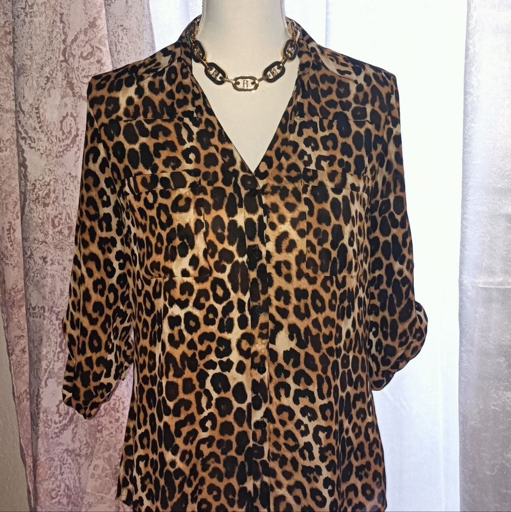 Leopard print, sheer, adjustable sleeves, button up, two pockets.
